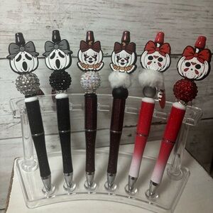 Halloween pens, keychains, and Stanley charms